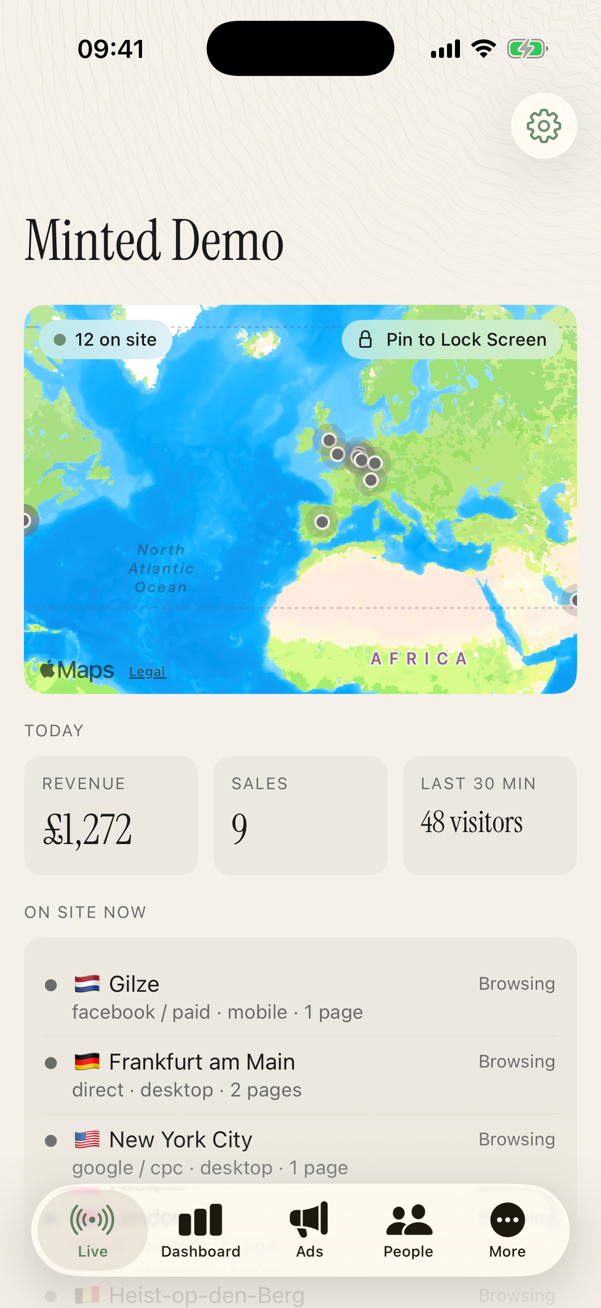 Minted Demo in the iPhone app, showing the live visitor map and recent store activity.
